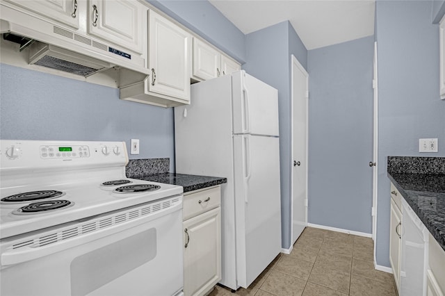 kitchen with white cabinetry, light tile patterned floors, white appliances, and dark stone counters