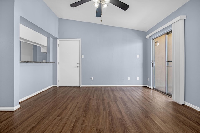 unfurnished living room with dark hardwood / wood-style flooring, vaulted ceiling, and ceiling fan