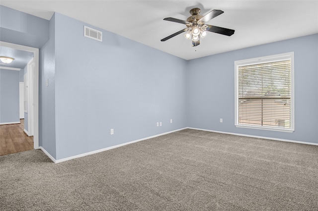 carpeted empty room with ceiling fan