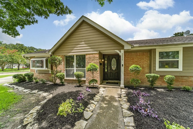 view of front of property featuring brick siding