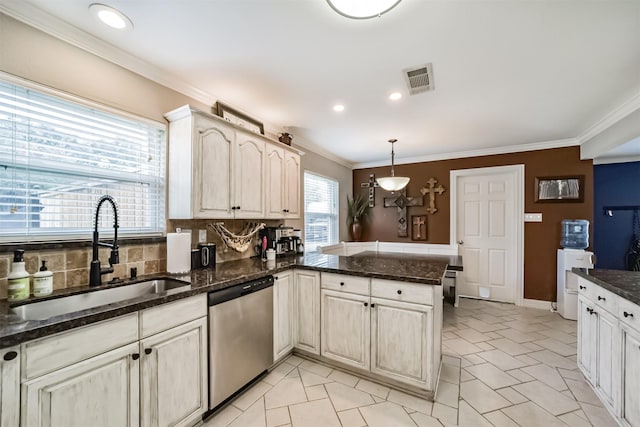 kitchen featuring sink, hanging light fixtures, ornamental molding, kitchen peninsula, and dishwasher