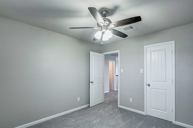 unfurnished bedroom featuring ceiling fan and carpet flooring