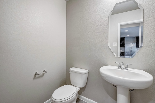 bathroom featuring toilet