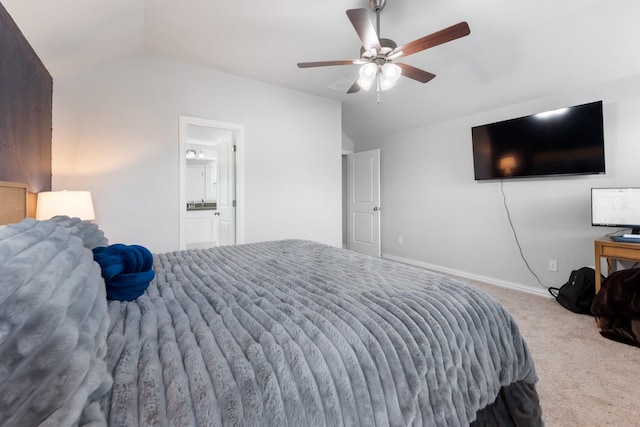 carpeted bedroom featuring lofted ceiling, ensuite bath, and ceiling fan