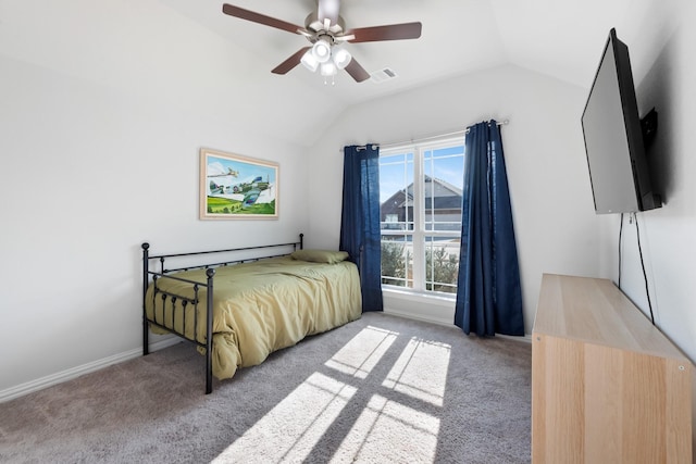 bedroom featuring ceiling fan, vaulted ceiling, and light carpet