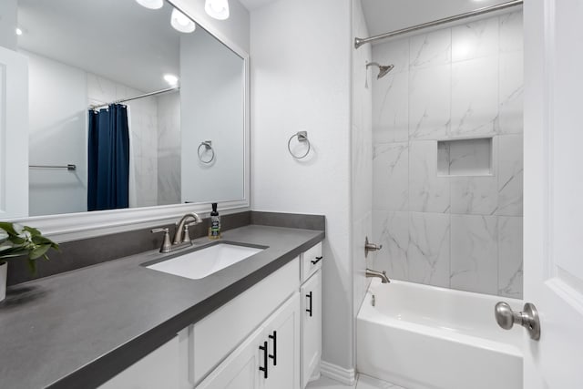 bathroom featuring vanity and shower / bath combo with shower curtain