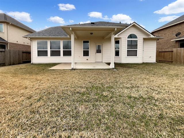 back of house with a yard and a patio area