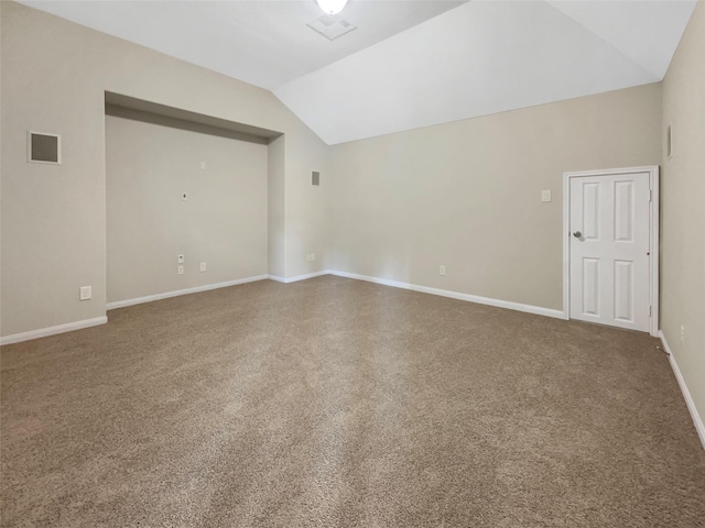 additional living space featuring carpet flooring and vaulted ceiling