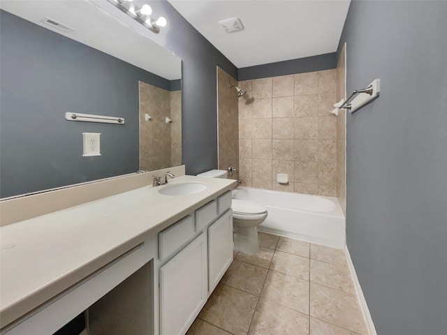 full bathroom featuring vanity, toilet, tiled shower / bath combo, and tile patterned flooring