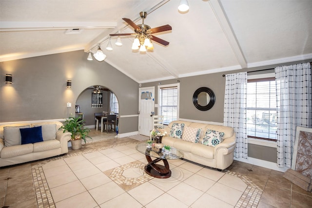 unfurnished living room with light tile patterned floors, crown molding, lofted ceiling with beams, and ceiling fan