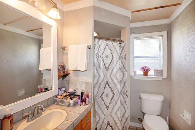 bathroom featuring vanity, toilet, and walk in shower