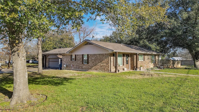 single story home featuring a garage and a front yard