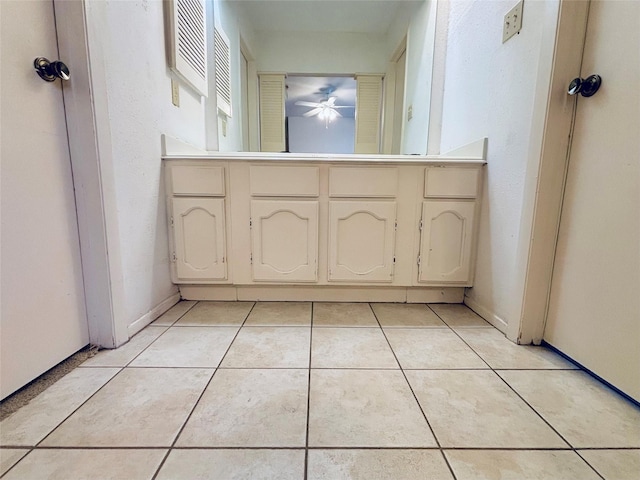 bathroom featuring baseboards and tile patterned floors