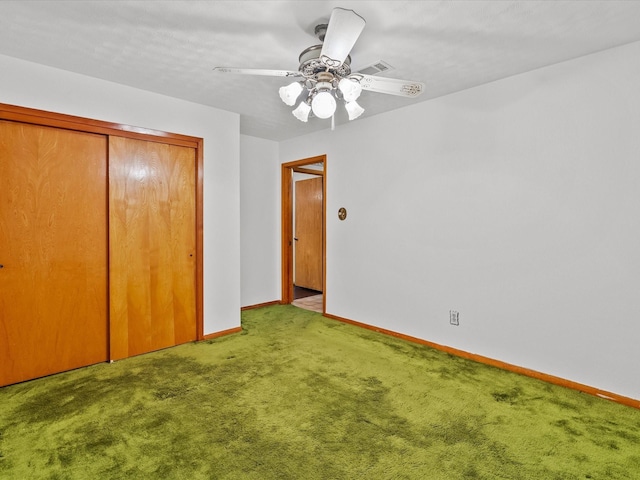 unfurnished bedroom with ceiling fan, light colored carpet, visible vents, baseboards, and a closet