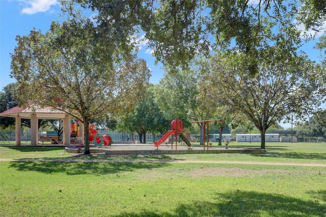 view of playground with a lawn