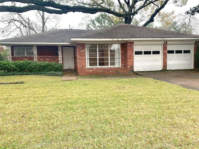 ranch-style house with a garage and a front yard