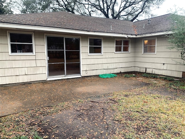 rear view of property featuring a patio