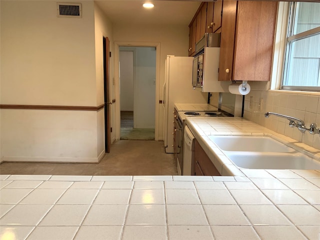 kitchen featuring sink and tile counters