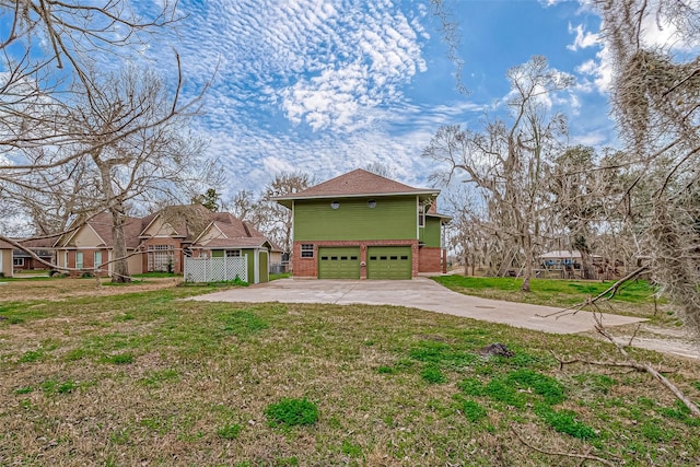 view of side of home with a garage and a yard