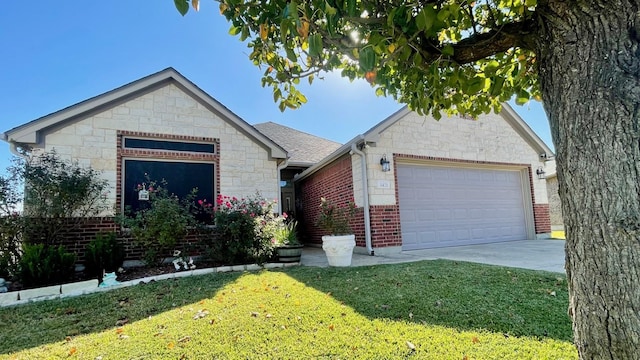 view of front of home with a garage and a front yard