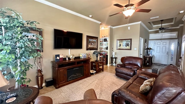 living room with crown molding, ceiling fan, a tray ceiling, and light colored carpet