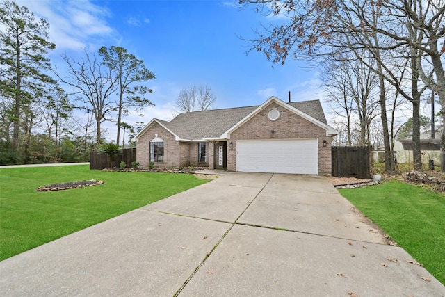 ranch-style house featuring a garage and a front yard