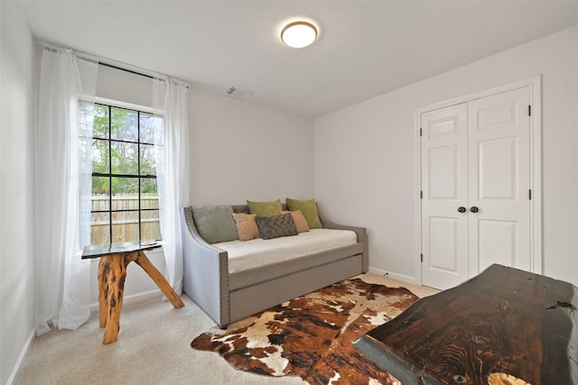 bedroom featuring carpet flooring, baseboards, and visible vents