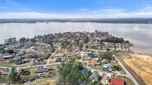 drone / aerial view with a residential view and a water view