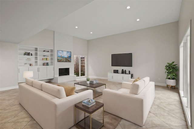 living room with a fireplace, built in features, and light tile patterned flooring