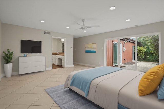 bedroom featuring connected bathroom, access to exterior, sink, and light tile patterned floors