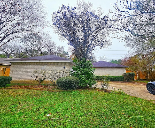 view of home's exterior featuring a lawn