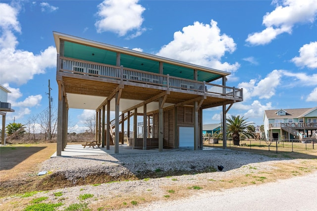 rear view of house featuring a garage