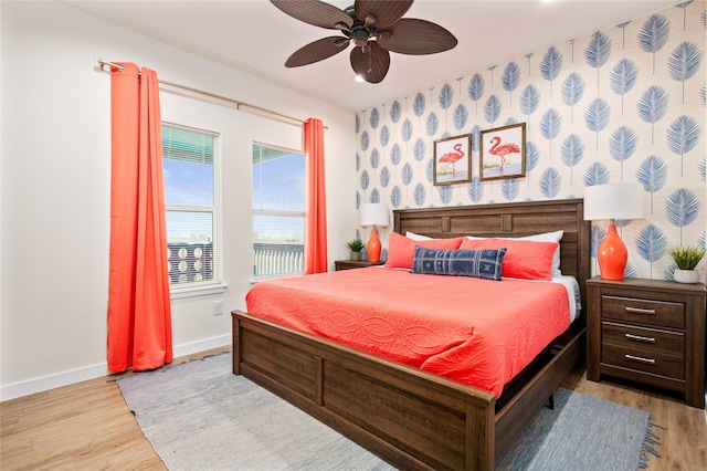 bedroom with light hardwood / wood-style flooring and ceiling fan