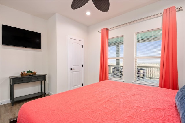 bedroom featuring wood-type flooring and ceiling fan