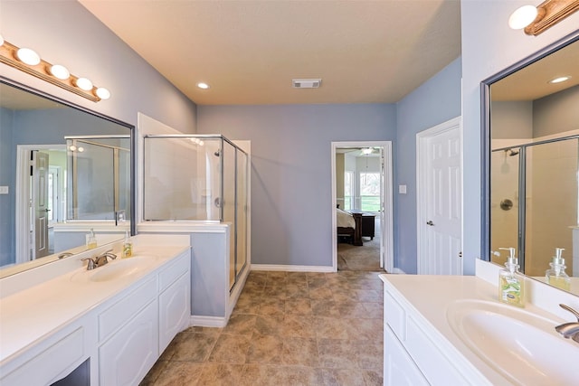 bathroom featuring vanity and a shower with shower door