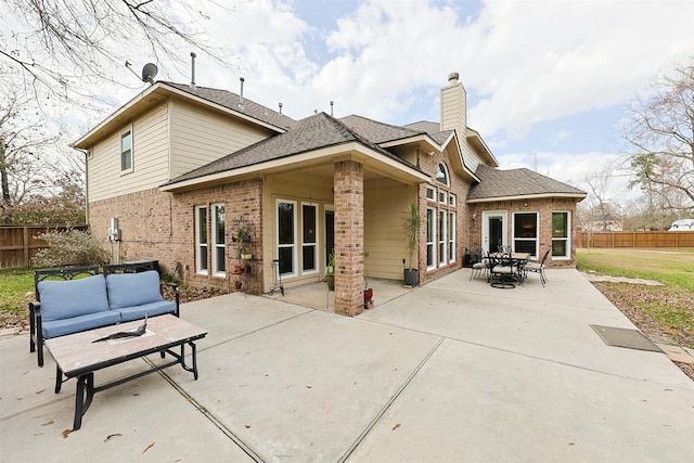 back of house featuring an outdoor hangout area and a patio