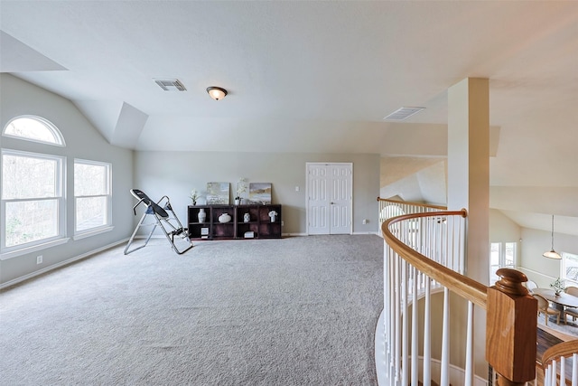 bonus room featuring carpet floors and vaulted ceiling