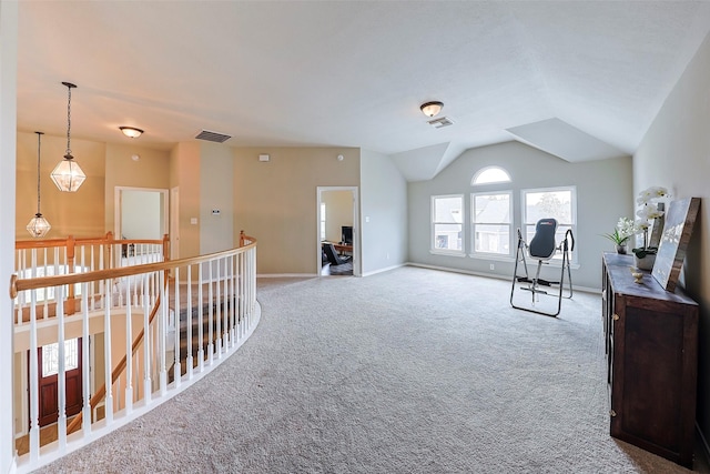 living area with lofted ceiling and carpet flooring