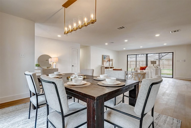 dining area with light hardwood / wood-style flooring