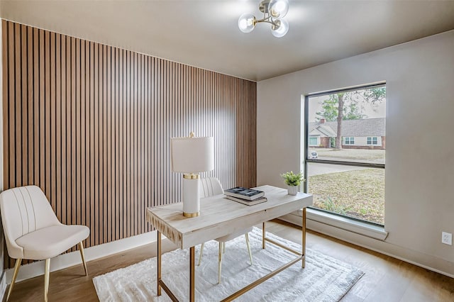 office space with wood-type flooring