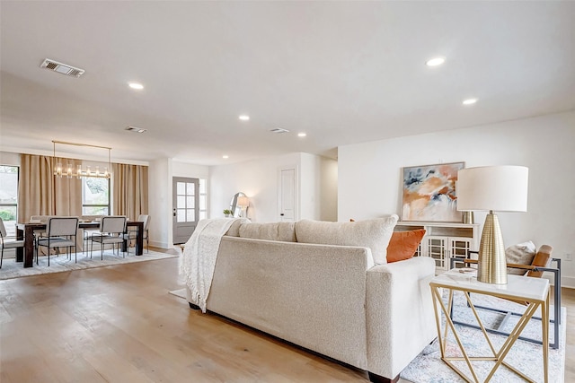 living room with light hardwood / wood-style flooring