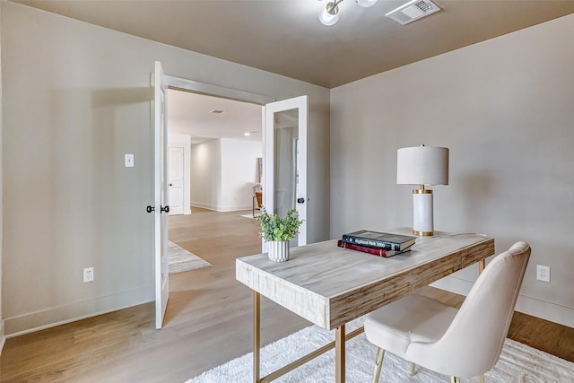 office area with light wood-type flooring