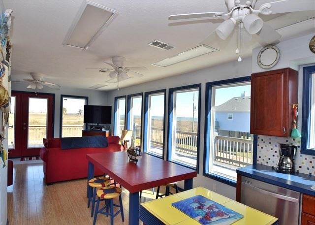 dining space featuring ceiling fan and light hardwood / wood-style floors