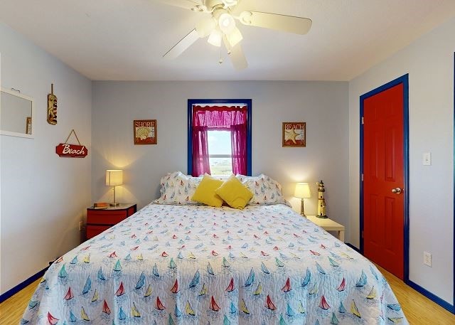 bedroom featuring ceiling fan and light hardwood / wood-style flooring