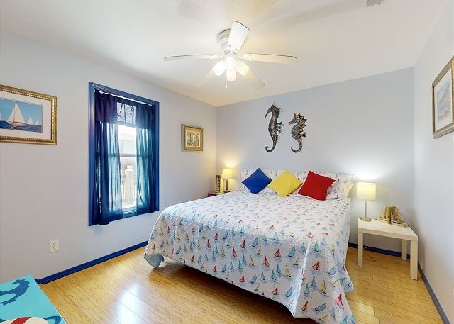 bedroom featuring hardwood / wood-style floors and ceiling fan