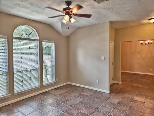 unfurnished room with vaulted ceiling, ceiling fan with notable chandelier, and a textured ceiling