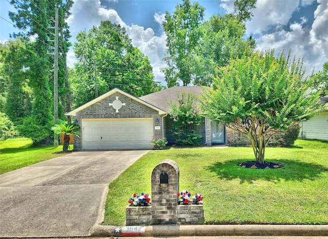 view of front of home featuring a garage and a front yard