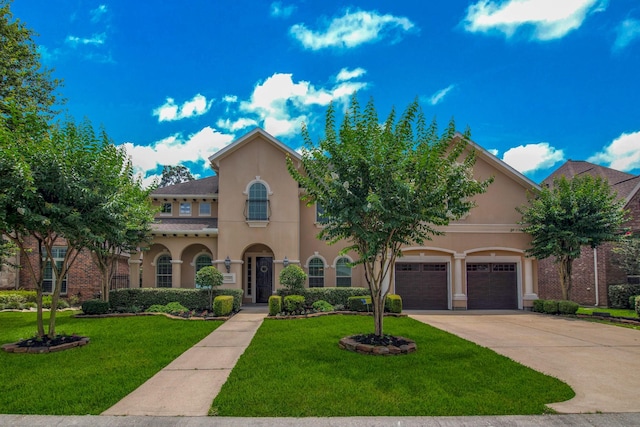 mediterranean / spanish house with a front yard