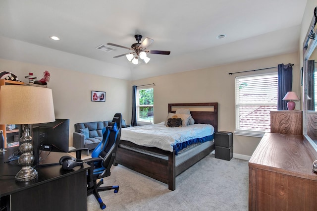 carpeted bedroom with lofted ceiling and ceiling fan