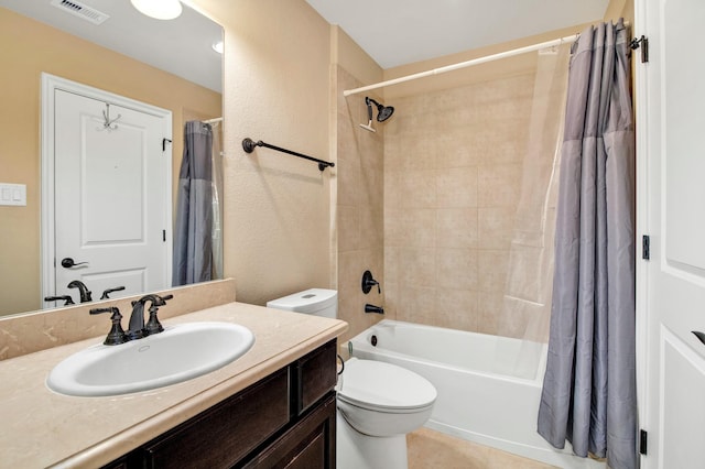 full bathroom with shower / bath combo, vanity, tile patterned floors, and toilet